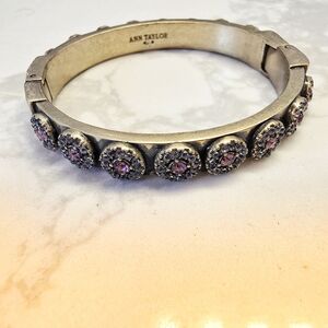 Ann Taylor gold-tone hinged bangle bracelet with round purple and black rhinesto
